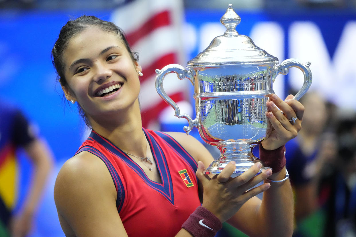 Sep 11, 2021; Flushing, NY, USA; Emma Raducanu of Great Britain celebrates with the championship trophy after her match against Leylah Fernandez of Canada (not pictured) in the women's singles final on day thirteen of the 2021 U.S. Open tennis tournament at USTA Billie Jean King National Tennis Center. Mandatory Credit: Robert Deutsch-USA TODAY Sports