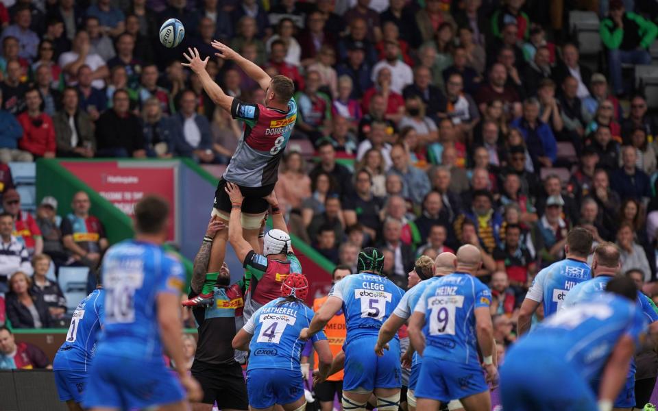 Alex Dombrandt catches a lineout during Quins' clash with Worcester - PA