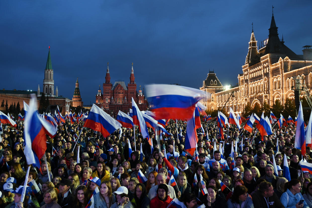 People attend a concert marking the declared annexation of the Russian-controlled territories of four Ukraine's Donetsk, Luhansk, Kherson and Zaporizhzhia regions, after holding what Russian authorities called referendums in the occupied areas of Ukraine that were condemned by Kyiv and governments worldwide, in Red Square in central Moscow, Russia, September 30, 2022. Sputnik/Maksim Blinov/Pool via REUTERS ATTENTION EDITORS - THIS IMAGE WAS PROVIDED BY A THIRD PARTY.