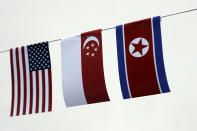 <p>The American, Singaporean and North Korean flags decorate the entrance of a local bar on Thursday, June 7, 2018, in Singapore. (Photo: Wong Maye-E/AP) </p>