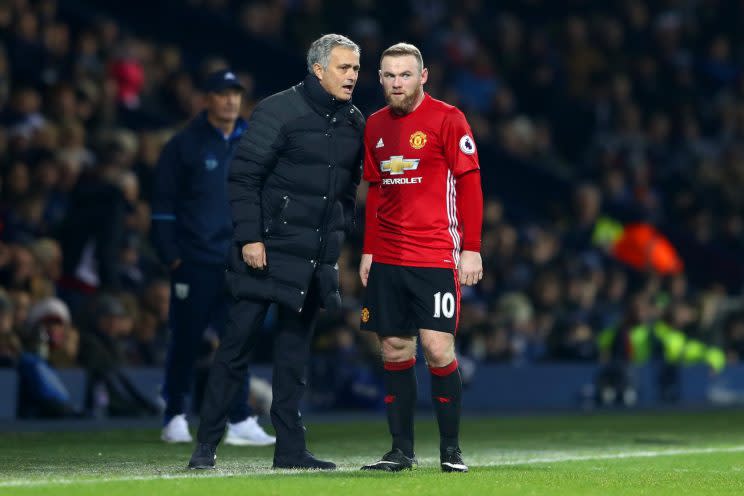 Manchester United boss Jose Mourinho gives skipper Wayne Rooney instructions