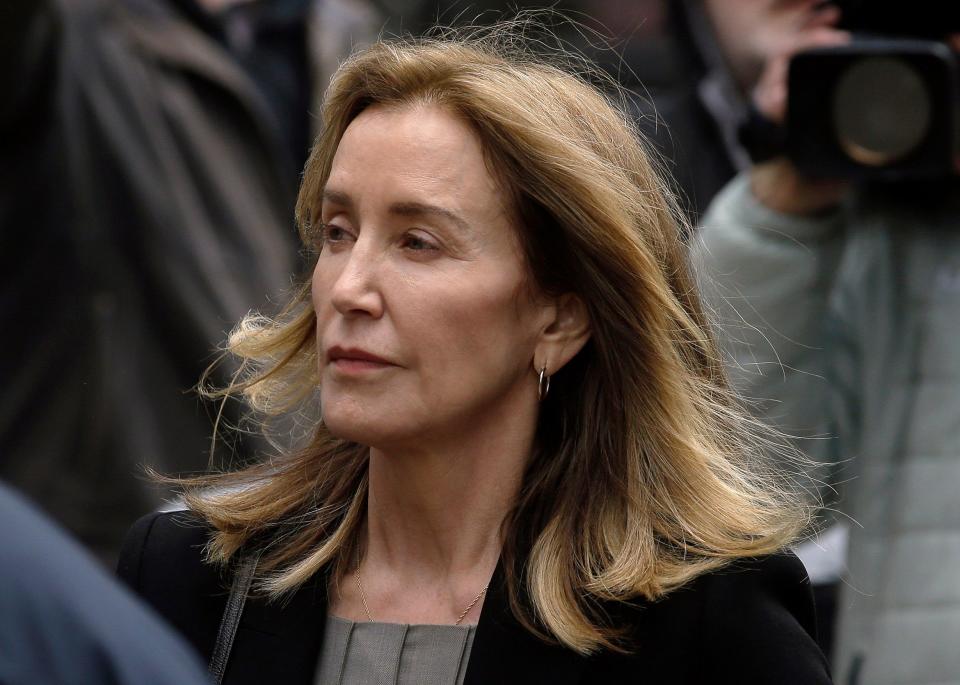 Felicity Huffman arrives at federal court Monday, May 13, 2019, in Boston, where she is scheduled to plead guilty to charges in a nationwide college admissions bribery scandal.