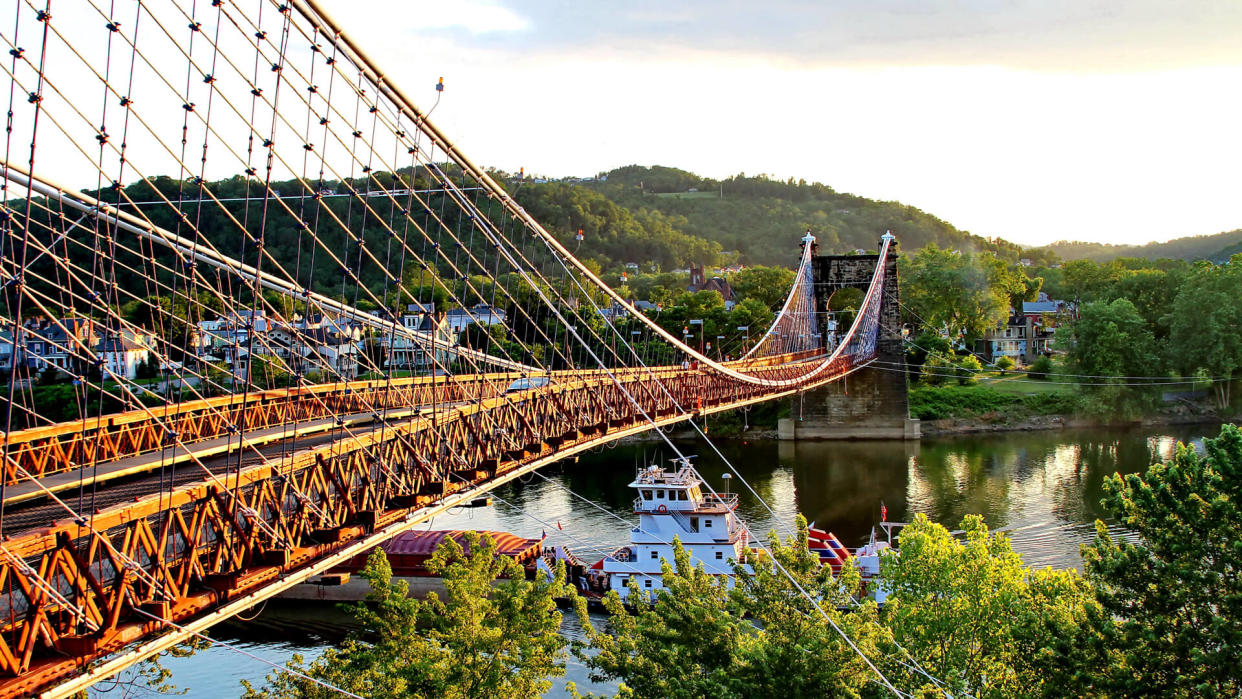 Large boat going under the suspension bridge at Wheeling, West Virginia.