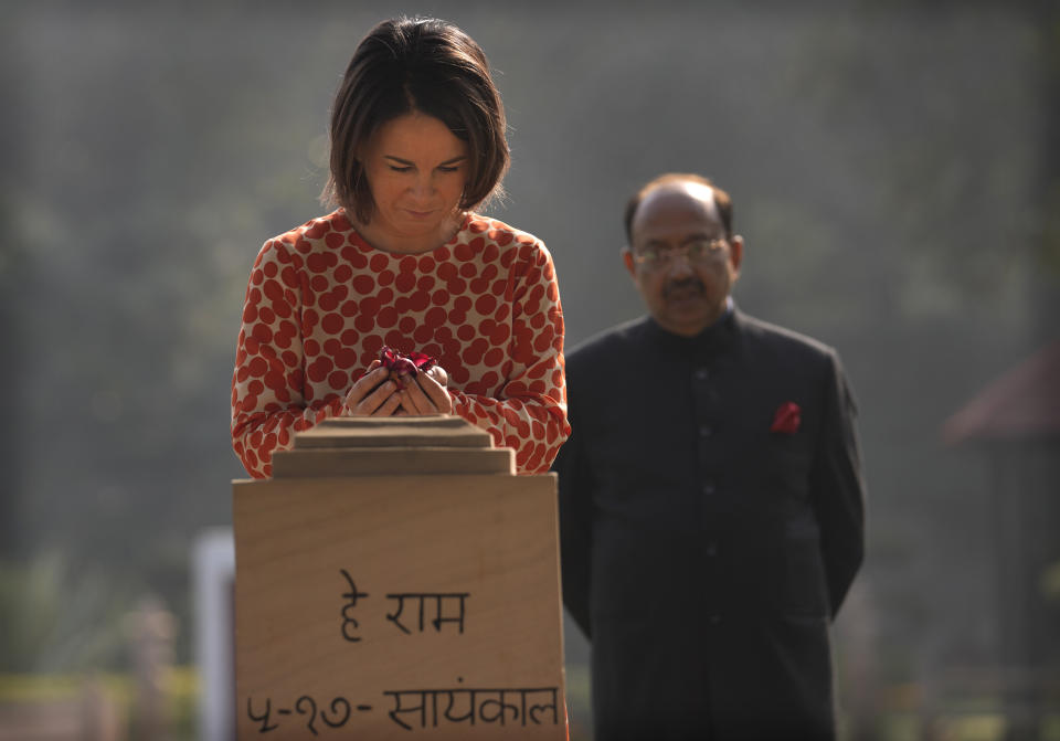 German Foreign Minister Annalena Baerbock, pays her respects at the Gandhi Smriti, a place where Mahatma Gandhi spent the last days of his life and was assassinated, in New Delhi, Monday, Dec. 5, 2022. Baerbock is on a two days official visit to India. (AP Photo/Manish Swarup)