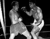 World Heavyweight Champion Muhammad Ali (R), (formerly Cassius Clay), and challenger Henry Cooper fight at Highbury Stadium, London, Britain May 21, 1966 for the World Heavyweight Boxing title. The fight was stopped in the sixth round due to cut above Cooper's left eye. Mandatory Credit: Action Images / MSI/File Photo