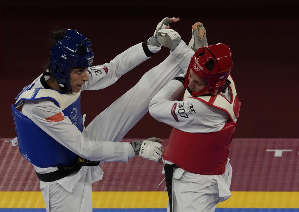 Turkey's Hatice Kübra İlgün, left, attacks United States's Anastasija Zolotic during the taekwondo women's 57kg match at the 2020 Summer Olympics, Sunday, July 25, 2021, in Tokyo, Japan. (AP Photo/Themba Hadebe)