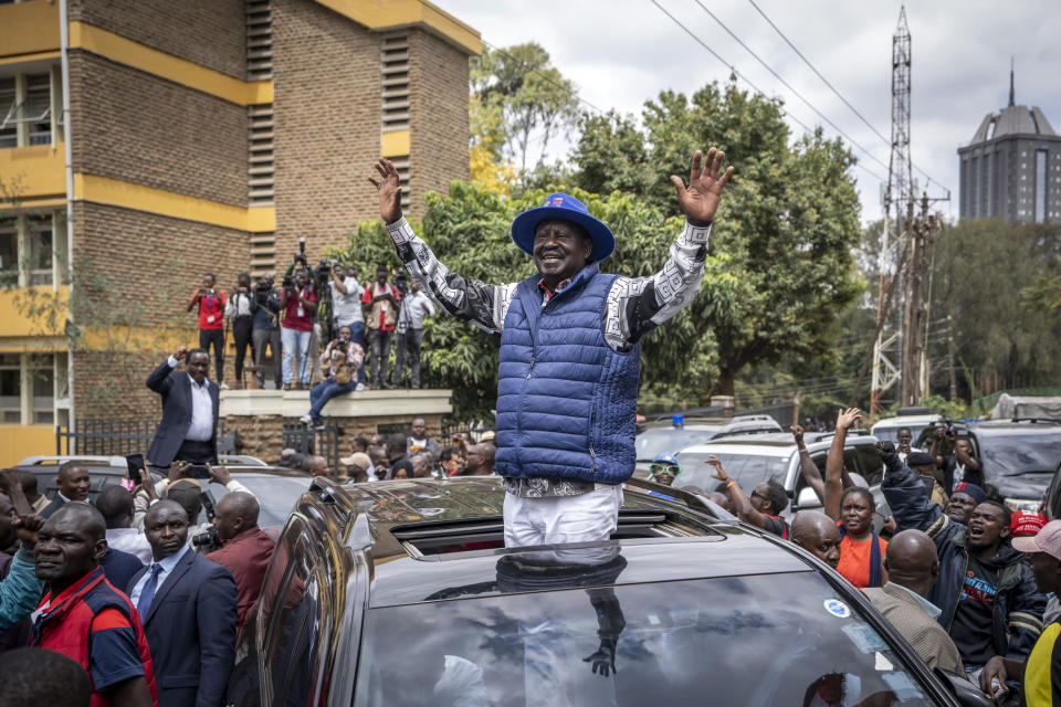 Presidential candidate Raila Odinga waves to supporters as he leaves the Supreme Court in Nairobi, Kenya Monday, Aug. 22, 2022. Odinga filed a Supreme Court challenge to last week's election result, asserting that the process was marked by criminal subversion and seeking that the outcome be nullified and a new vote be ordered. (AP Photo/Ben Curtis)