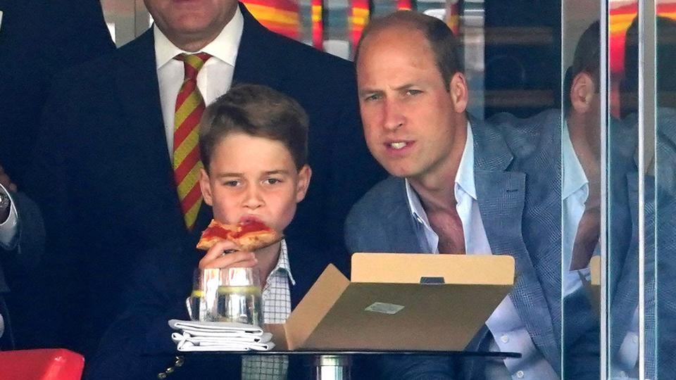 Prince George eats pizza on a day out at the Ashes with Prince William