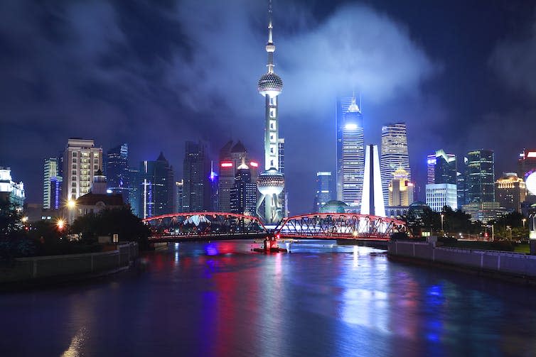 Shanghai skyline at night from the sea.