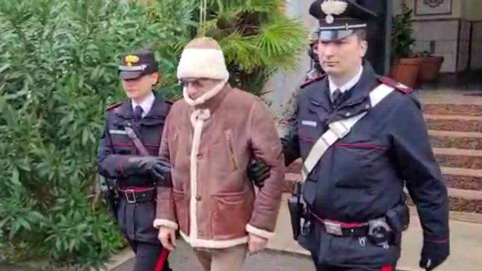 A screengrab taken from a video shows Matteo Messina Denaro being escorted out of a Carabinieri police station after his January arrest in Palermo, Italy. - Carabinieri/Reuters