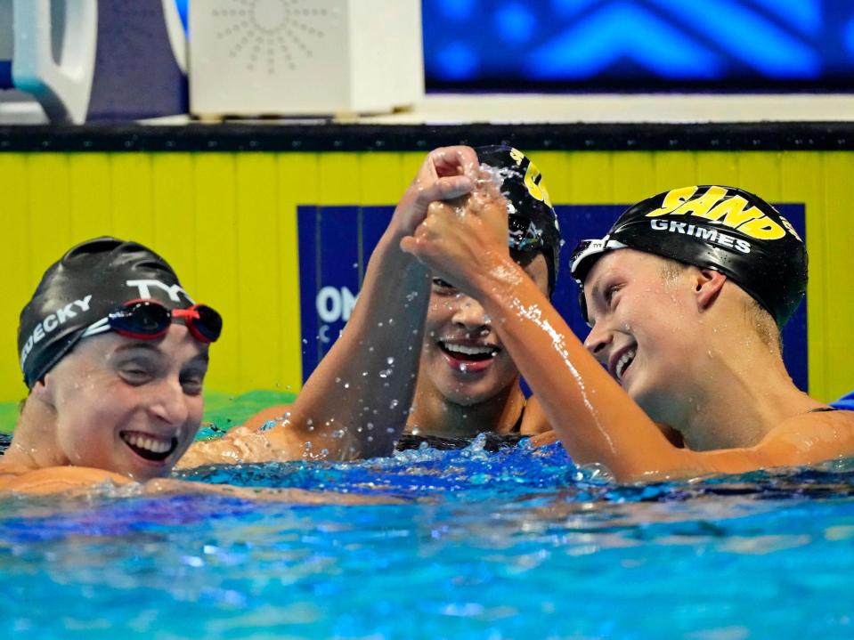 Katie Ledecky (left) congratulates Katie Grimes after her 800-meter freestyle swim.