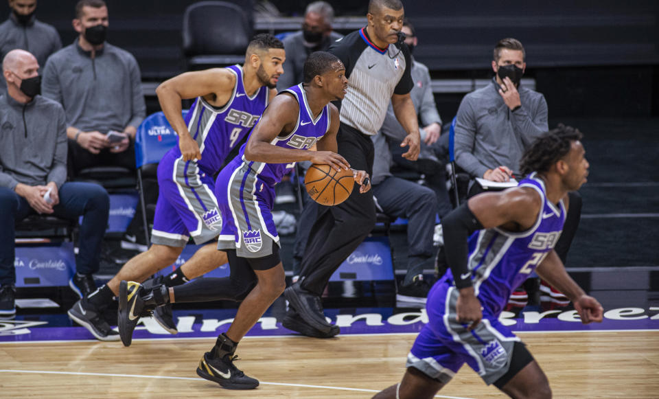 Sacramento Kings guard De'Aaron Fox (5) drives to the basket after guard Cory Joseph (9) stole the ball from the Atlanta Hawks during the first quarter of an NBA basketball game in Sacramento, Calif., Wednesday, March 24, 2021. (AP Photo/Hector Amezcua)