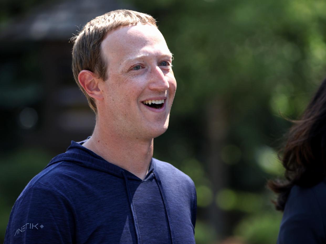 Mark Zuckerberg smiles while walking outside at 2021 Sun Valley conference