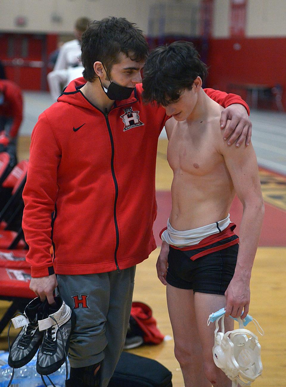 The Holliston High School wrestling team defeated Bellingham, 47-30, on Senior Night on Jan. 26, 2022. Senior captain Matt Amante (left) and junior Anthony Touchette shown after the match.