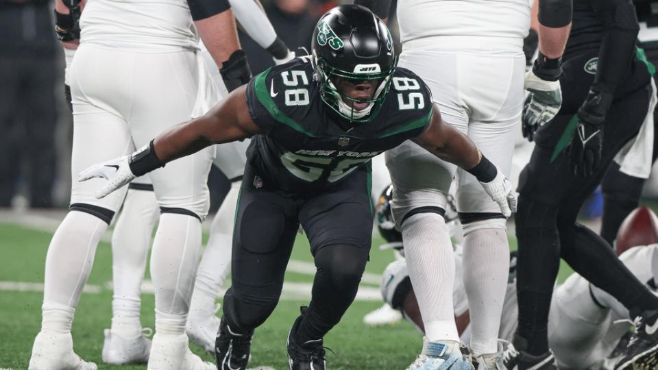 New York Jets defensive end Carl Lawson (58) celebrates a defensive stop during the first half against the Jacksonville Jaguars at MetLife Stadium