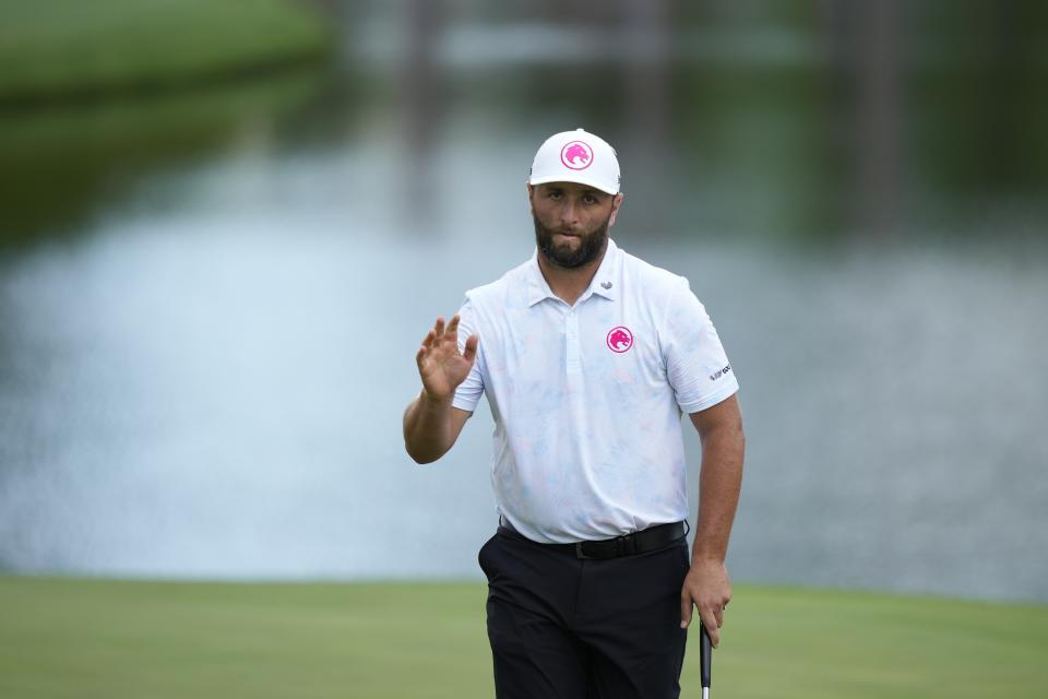 Jon Rahm, of Spain, waves after making a putt on the 16th hole during the first round at the Masters golf tournament at Augusta National Golf Club Thursday, April 11, 2024, in Augusta, Ga. (AP Photo/Matt Slocum)