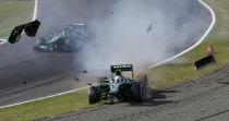 Caterham Formula One driver Giedo van der Garde of Netherlands crashes after colliding with Marussia Formula One driver Jules Bianchi of France during the Japanese F1 Grand Prix at the Suzuka circuit October 13, 2013. REUTERS/Issei Kato (JAPAN - Tags: SPORT MOTORSPORT F1 TPX IMAGES OF THE DAY)