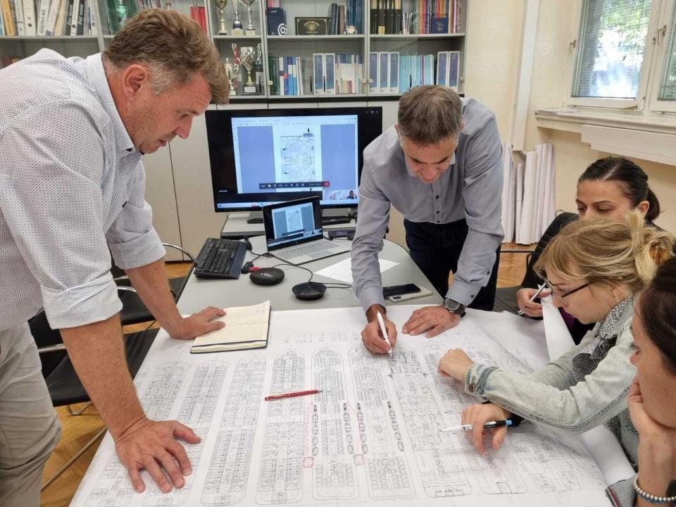 Paul Read, left, working with colleagues on ship designs.
