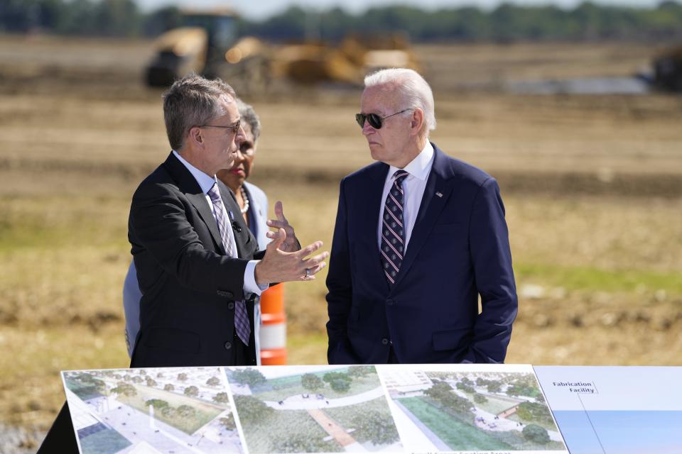 Intel CEO Pat Gelsinger, left, speaks to President Joe Biden, right, in front of plans and renderings at a groundbreaking ceremony for Intel's $20 billion microchip manufacturing project. Adam Cairns/Columbus Dispatch