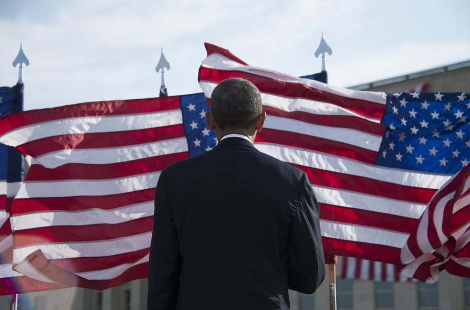 President Barack Obama stands at the Pentagon in Washington, DC, September 11, 2014, for a moment of silence marking the 13th anniversary of the 9/11 attacks on the United States.  (JIM WATSON/AFP/Getty Images)