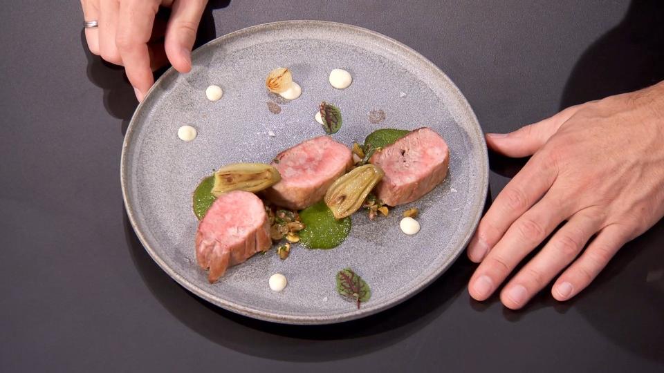 Grant Gillon made pork loin medallions with salmoriglio sauce, agrodolce, celery root puree and beer braised fennel and onions on the finale of "MasterChef."