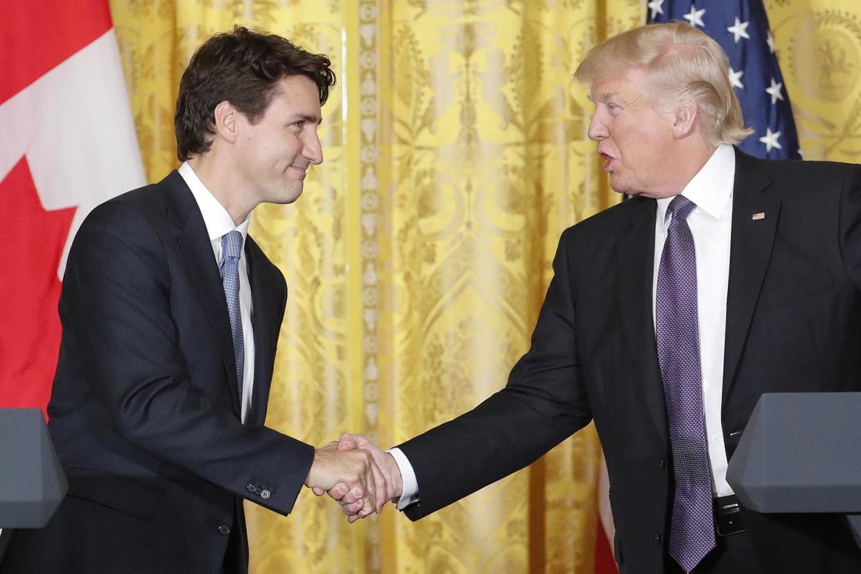 First meeting: President Donald Trump and Canadian Prime Minister Justin Trudeau shake hands: AP