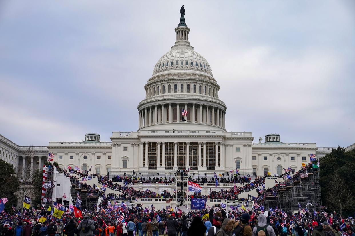 Trump supporters gather outside the Capitol on Wednesday, Jan. 6, 2021, in Washington. As Congress prepares to affirm President-elect Joe Biden's victory, thousands of people have gathered to show their support for President Donald Trump and his claims of election fraud.