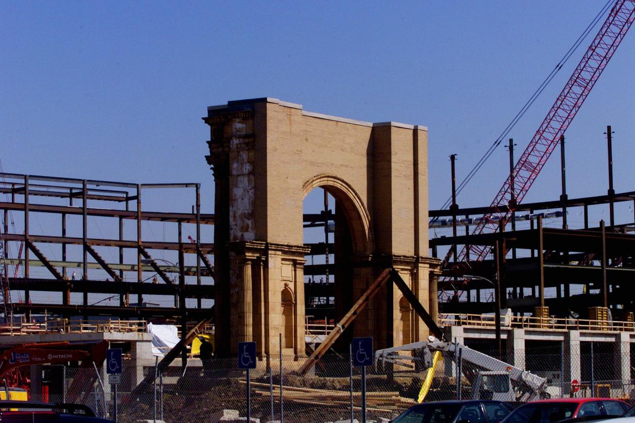 1999 - The 400-ton Union Station arch sits at its new location near the Nationwide Arena which is under construction. The arch still has to be lowered into place.