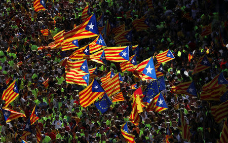 Esteladas (Catalan separatist flags) are waved as thousands of people gather for a rally on Catalonia's national day 'La Diada' in Barcelona, Spain, September 11, 2017. REUTERS/Susana Vera