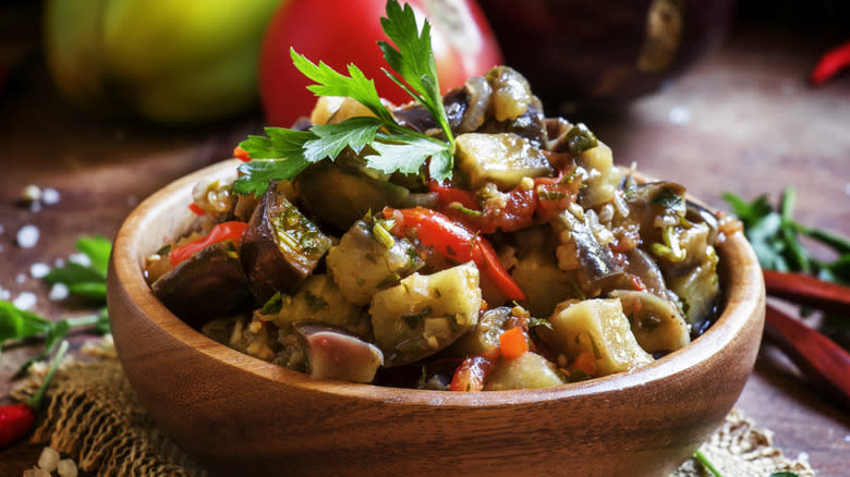 eggplant salad in wooden bowl 