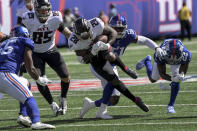 Atlanta Falcons running back Mike Davis (28) runs the ball against New York Giants linebacker Azeez Ojulari (51) during the first half of an NFL football game, Sunday, Sept. 26, 2021, in East Rutherford, N.J. (AP Photo/Bill Kostroun)