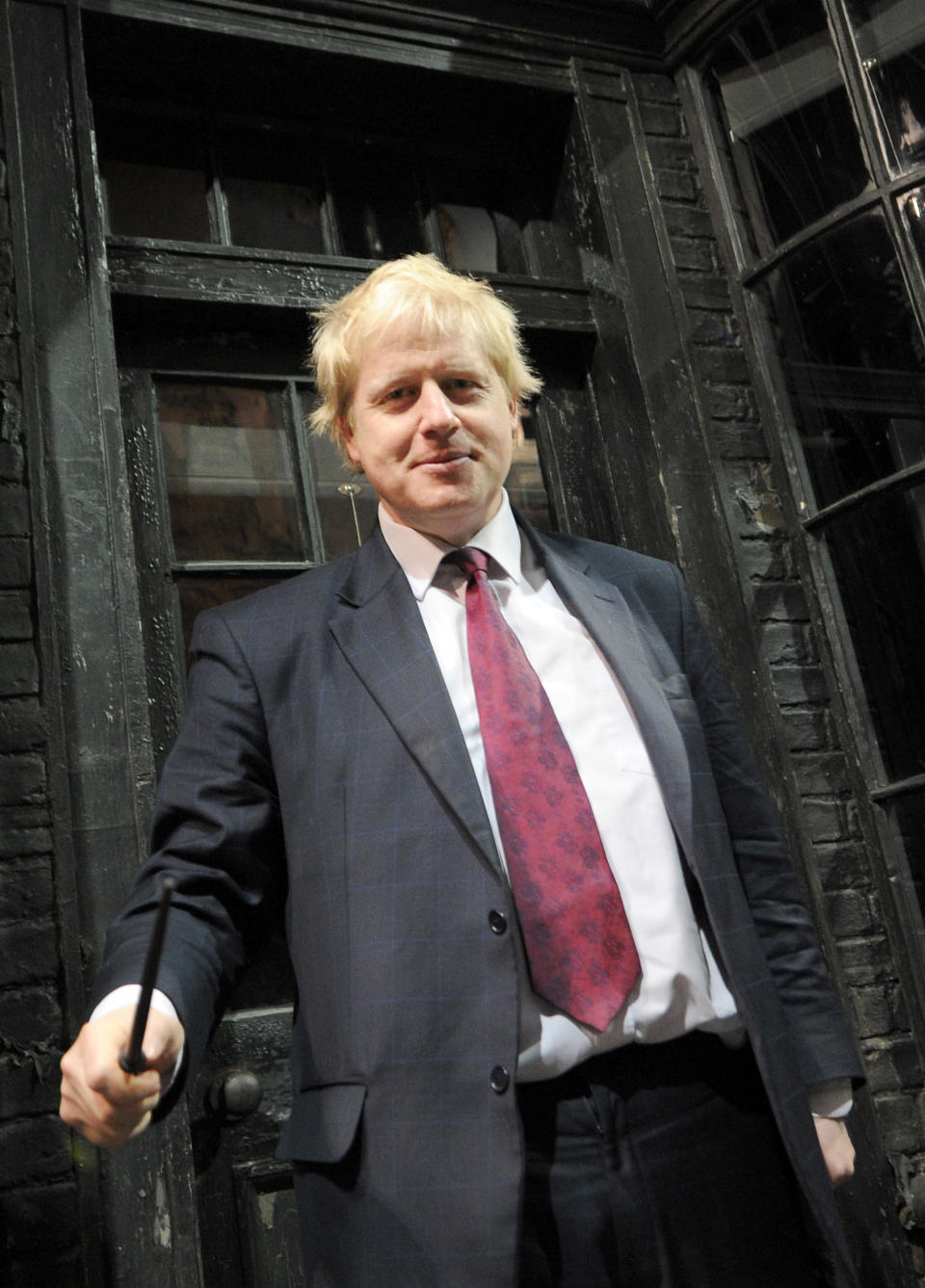 Mayor of London Boris Johnson waves a wand in Diagon Alley as he visits the new attraction 'The Making of Harry Potter' at Warner Brothers studios in Leavesden, Hertfordshire. PRESS ASSOCIATION Photo Monday December 19, 2011. Photo credit should read: Anthony Devlin/PA