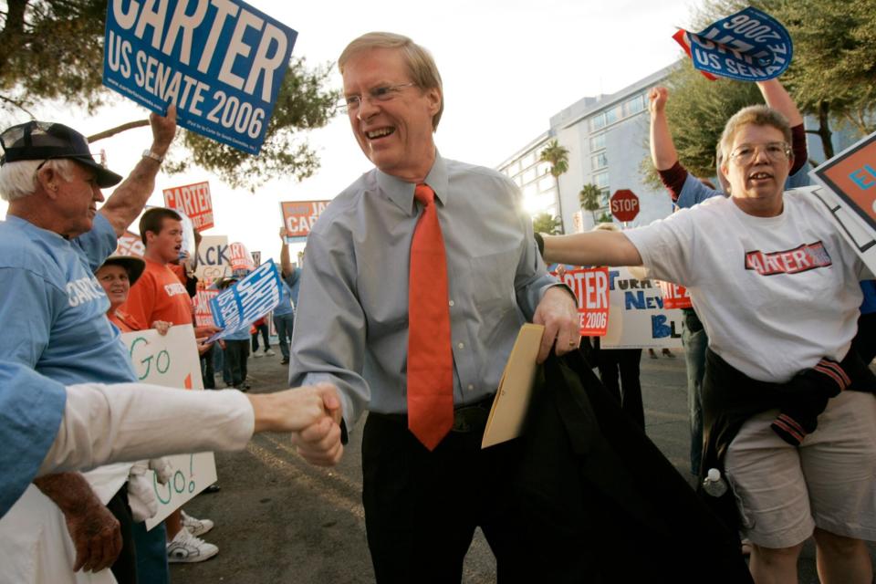 U.S. Senate candidate Jack Carter is greeted by supporters as he walks into the Channel 8 studios in Las Vegas for a debate with incumbent U.S. Sen. John Ensign, R-Nev., Sunday, Oct. 15, 2006. (AP Photo/John Locher)