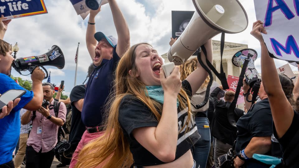 Anti-abortion activists celebrate the Dobbs v Jackson Women's Health Organization ruling in front of the U.S. Supreme Court on June 24, 2022. - Brandon Bell/Getty Images