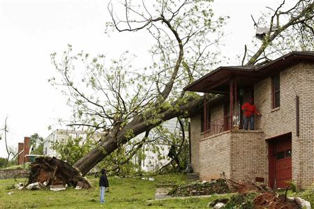 Fallen trees and damaged homes are shown in Bessemer, Alabama, April 29, 2014. REUTERS/Marvin Gentry