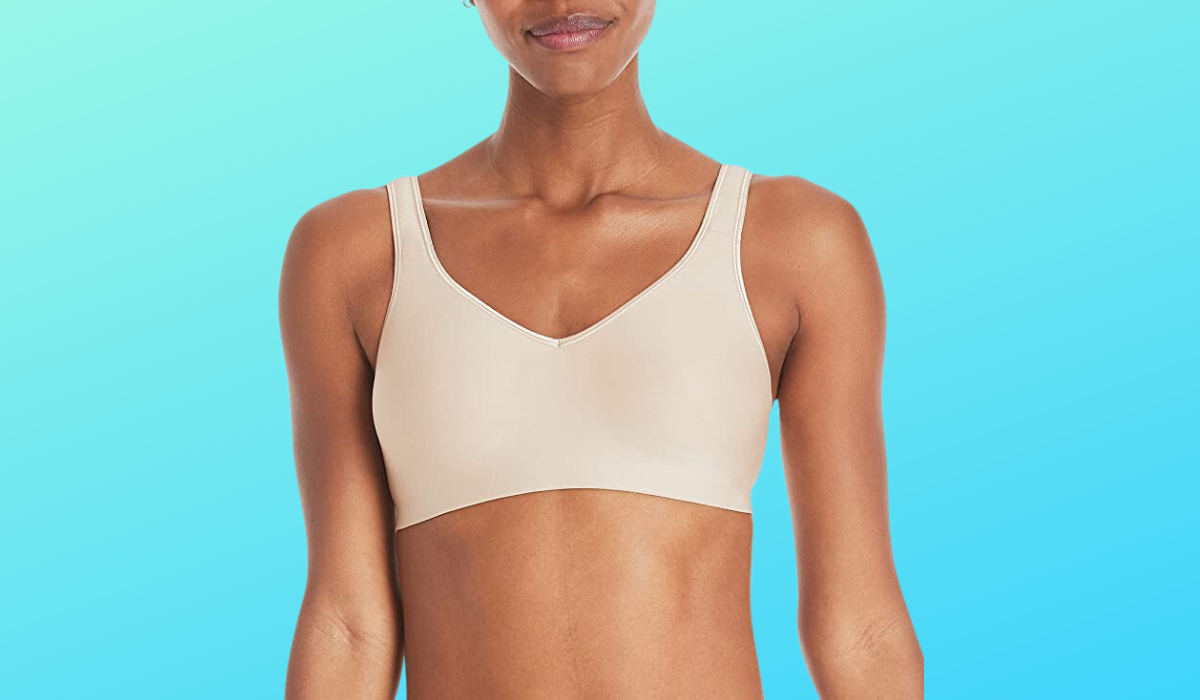 Torso of woman wearing beige T-shirt bra.