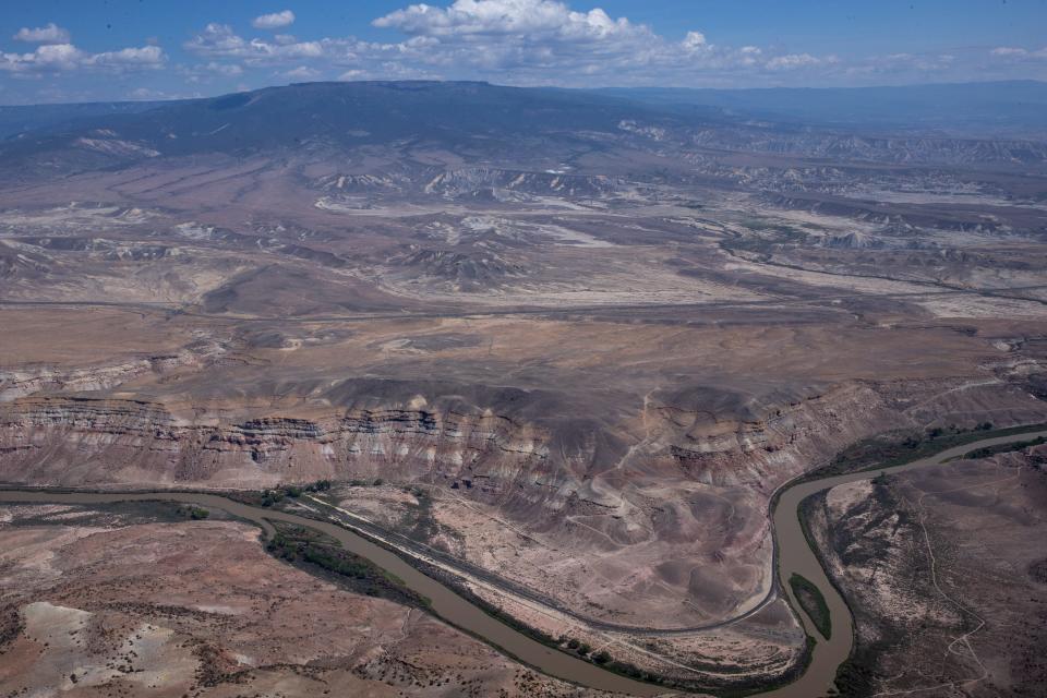 The Gunnison River (bottom) and Grand Mesa (top) on Aug. 22, 2021, east of Grand Junction, Colorado.