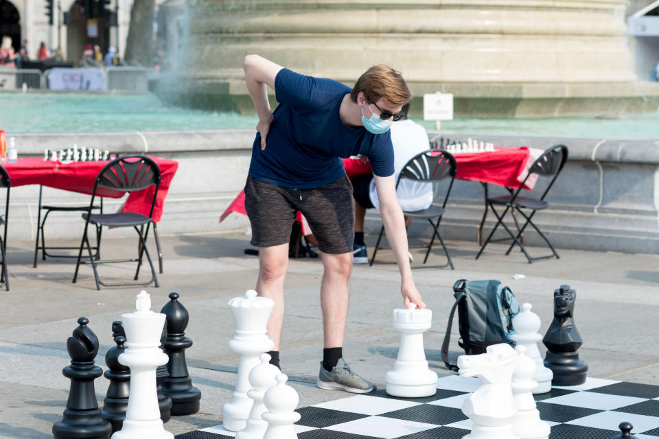 <p>A man seen taking his next move while playing on the life-sized chess set. The Chess Fest, held by Chess in Schools and Communities (CSC), supported by Mayor of London and XTX Markets, took place on the 18th of July at Trafalgar Square in London. Free chess lessons were offered from professional chess teachers and top UK players, and giant life-sized chessboards were set up for people to play on. The festival was held to promote the playing of chess as an intellectually stimulating activity. (Photo by Belinda Jiao / SOPA Images/Sipa USA)</p>

