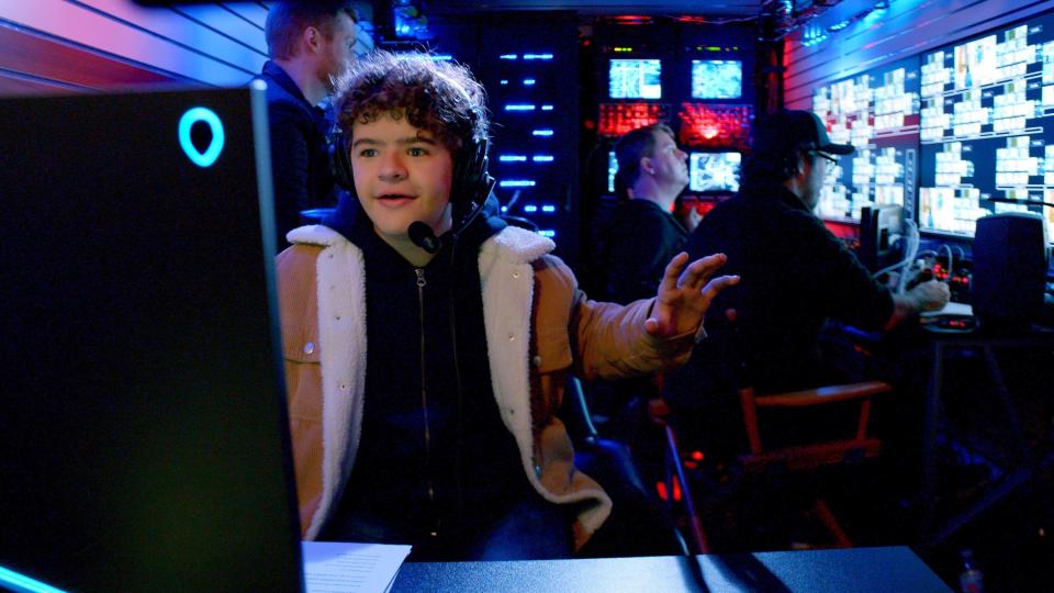 Gaten at a computer in a scene from Prank Encounters