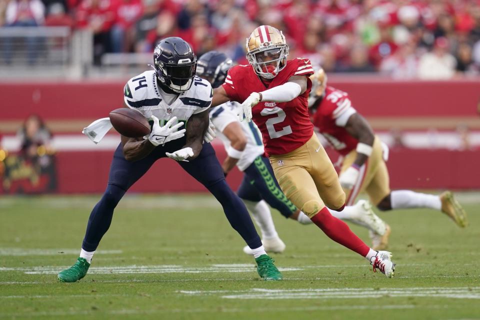 Dec 10, 2023; Santa Clara, California, USA; Seattle Seahawks wide receiver <a class="link " href="https://sports.yahoo.com/nfl/players/31896" data-i13n="sec:content-canvas;subsec:anchor_text;elm:context_link" data-ylk="slk:DK Metcalf;sec:content-canvas;subsec:anchor_text;elm:context_link;itc:0">DK Metcalf</a> (14) is unable to make a catch next to <a class="link " href="https://sports.yahoo.com/nfl/teams/san-francisco/" data-i13n="sec:content-canvas;subsec:anchor_text;elm:context_link" data-ylk="slk:San Francisco 49ers;sec:content-canvas;subsec:anchor_text;elm:context_link;itc:0">San Francisco 49ers</a> cornerback <a class="link " href="https://sports.yahoo.com/nfl/players/33560" data-i13n="sec:content-canvas;subsec:anchor_text;elm:context_link" data-ylk="slk:Deommodore Lenoir;sec:content-canvas;subsec:anchor_text;elm:context_link;itc:0">Deommodore Lenoir</a> (2) in the fourth quarter at Levi’s Stadium. Mandatory Credit: Cary Edmondson-USA TODAY Sports