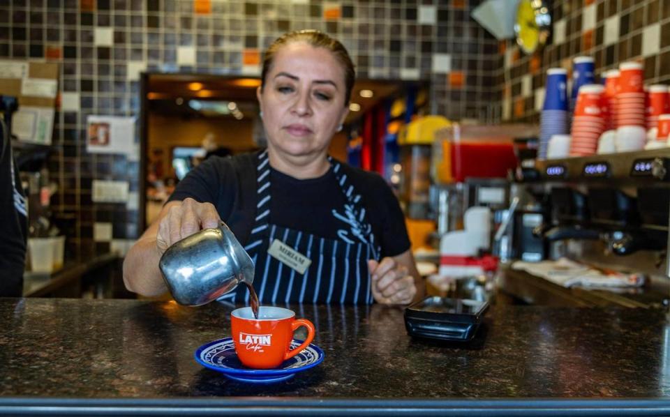 Waitress Miriam Ascencio serves a Cuban cafecito at la ventanita in the Latin Cafe 2000 in Miami. Pedro Portal/pportal@miamiherald.com