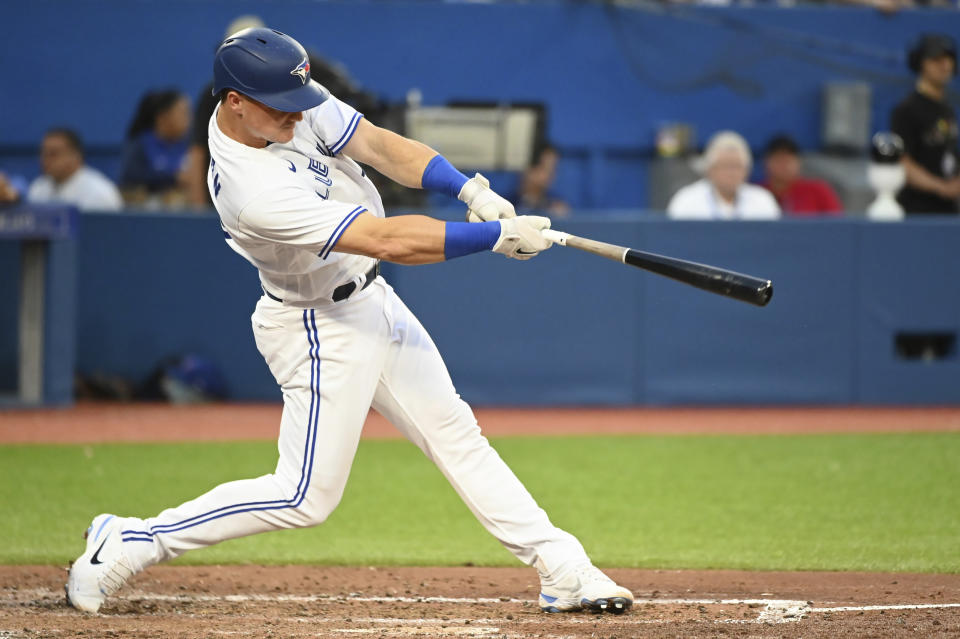 Toronto Blue Jays' Danny Jansen hits a solo home run against the Kansas City Royals during the fifth inning of a baseball game Thursday, July 14, 2022, in Toronto. (Jon Blacker/The Canadian Press via AP)