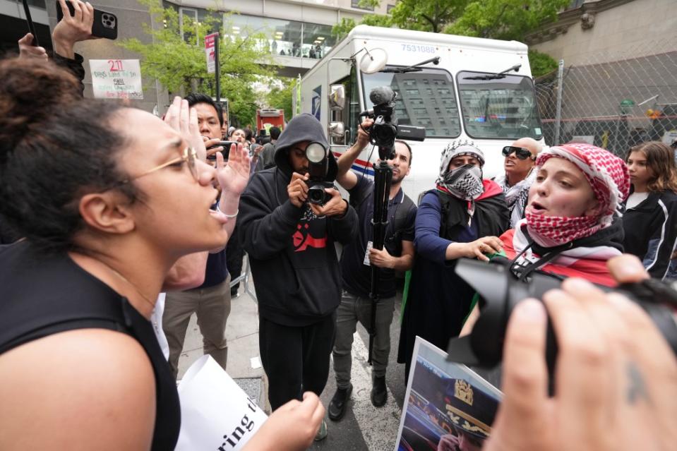 Pro-Palestine and pro-Israeli protesters arguing on Monday. James Keivom