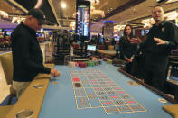 Dealers conduct a game of roulette at the Hard Rock casino in Atlantic City N.J. on May 17, 2023. On Jan, 16, 2023, New Jersey gambling regulators released statistics showing that Atlantic City's casinos, racetracks that accept sports betting and their online partners won nearly $5.8 billion from gamblers in 2023, a new record. But only three of the nine casinos won more from in-person gamblers last year than they did in 2019 before the coronavirus pandemic broke out. (AP Photo/Wayne Parry)