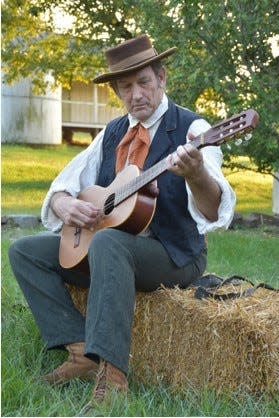 Paul Caudell entertains visitors during Murder, Medicine & Mourning at Wynnewood.