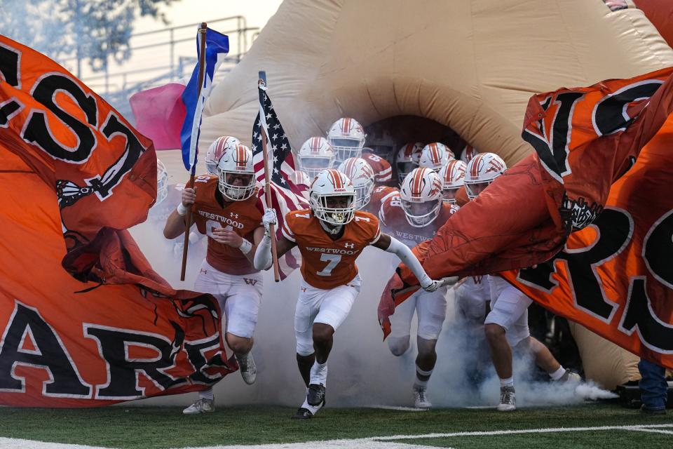 Westwood defensive back Chester Bennett leads the Warriors onto the field at Kelly Reeves Stadium prior to Thursday night's game against Vista Ridge. The Rangers won 26-21. The rest of Central Texas plays a busy schedule on Friday night.