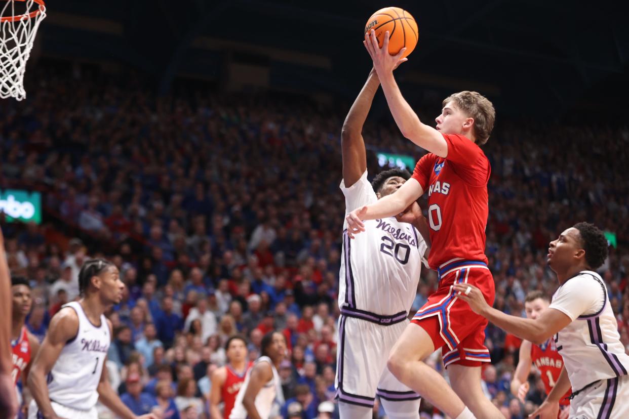 Kansas freshman guard Johnny Furphy (10) jumps for a layup a against Kansas State in the first half of the Sunflower Showdown inside Allen Fieldhouse on March 5, 2024.