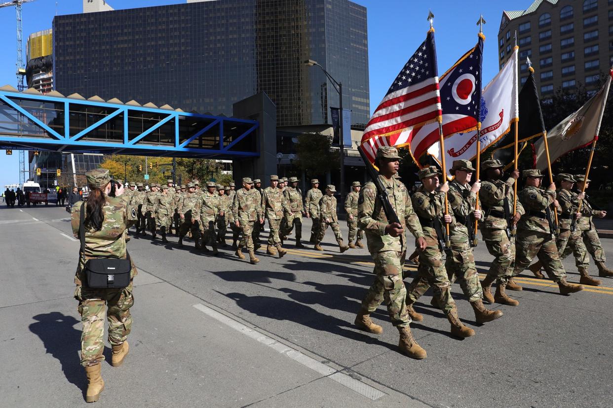 Columbus West High School marches in 2021 Veterans Day parade.