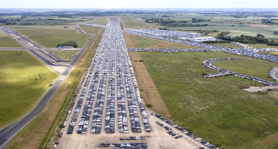 THURLEIGH, BEDFORDSHIRE - JUNE 09: Thousands of unwanted new and used cars line up on June 09, 2020, at Thurleigh Airfield in Bedfordshire. Britain's economy slumped by 20.4% in April in the biggest monthly decline since records began as the coronavirus lockdown paralyzed the country. (Permission from Aerodrome for flight). (Photo by Chris Gorman/Getty Images)