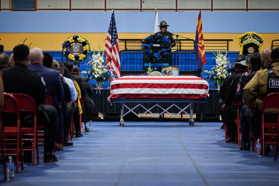 Acting captain of the White Mountain Apache Police Department, Steven Kane, delivers the closing remarks for Officer Adrian Lopez's funeral at the Chief Alchesay Activity Center in Whiteriver on June 9, 2022.